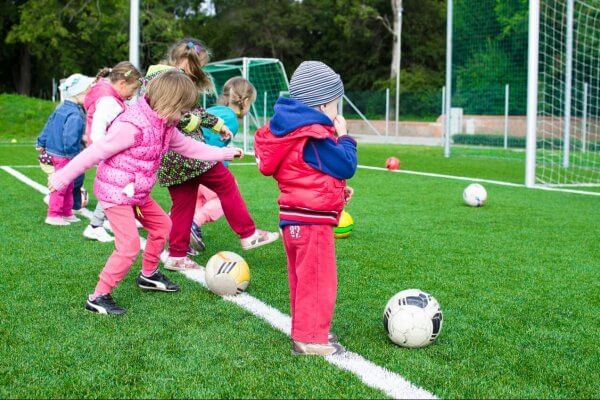 Girls and boys playing football, gender neutrality how important is it for kids’ worlds?, Be Curious