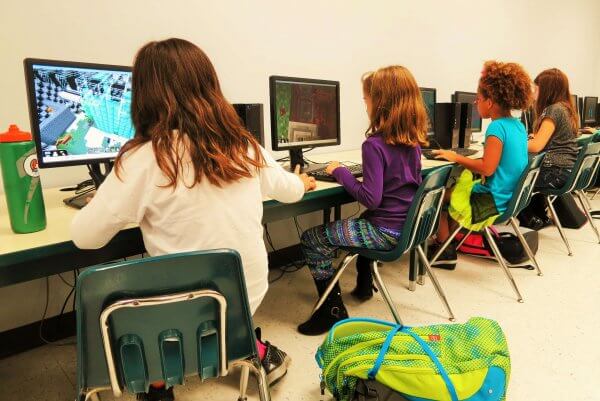 Image of children playing Minecraft in the classroom, Be Curious